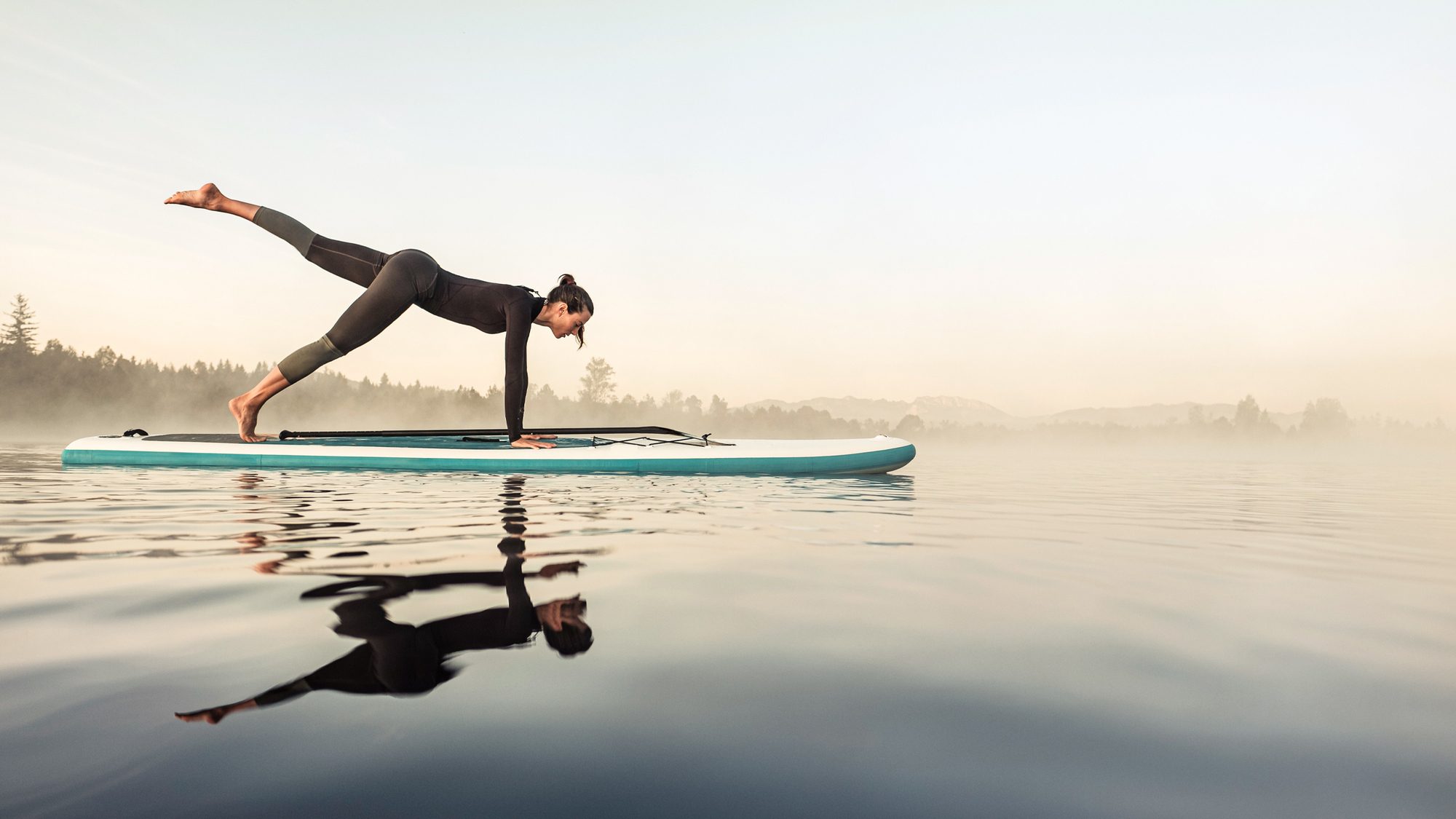 [Planning] Woman on paddleboard in yoga pose